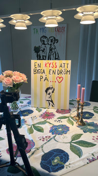 "En kyss att bygga en dröm på"